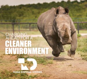 TDS rhino with the words charging ahead for a cleaner environment