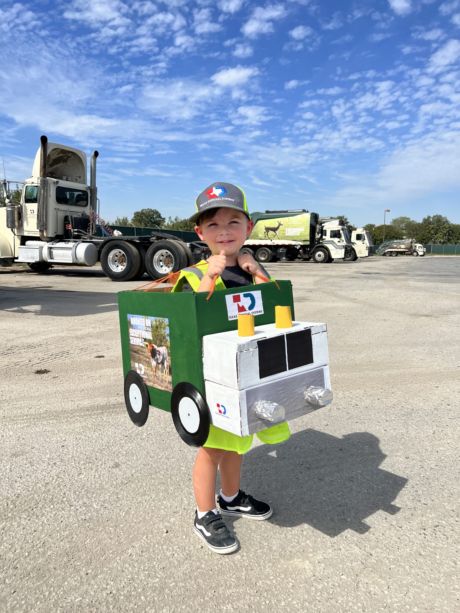 Little boy dressed up as a TDS garbage truck for Halloween