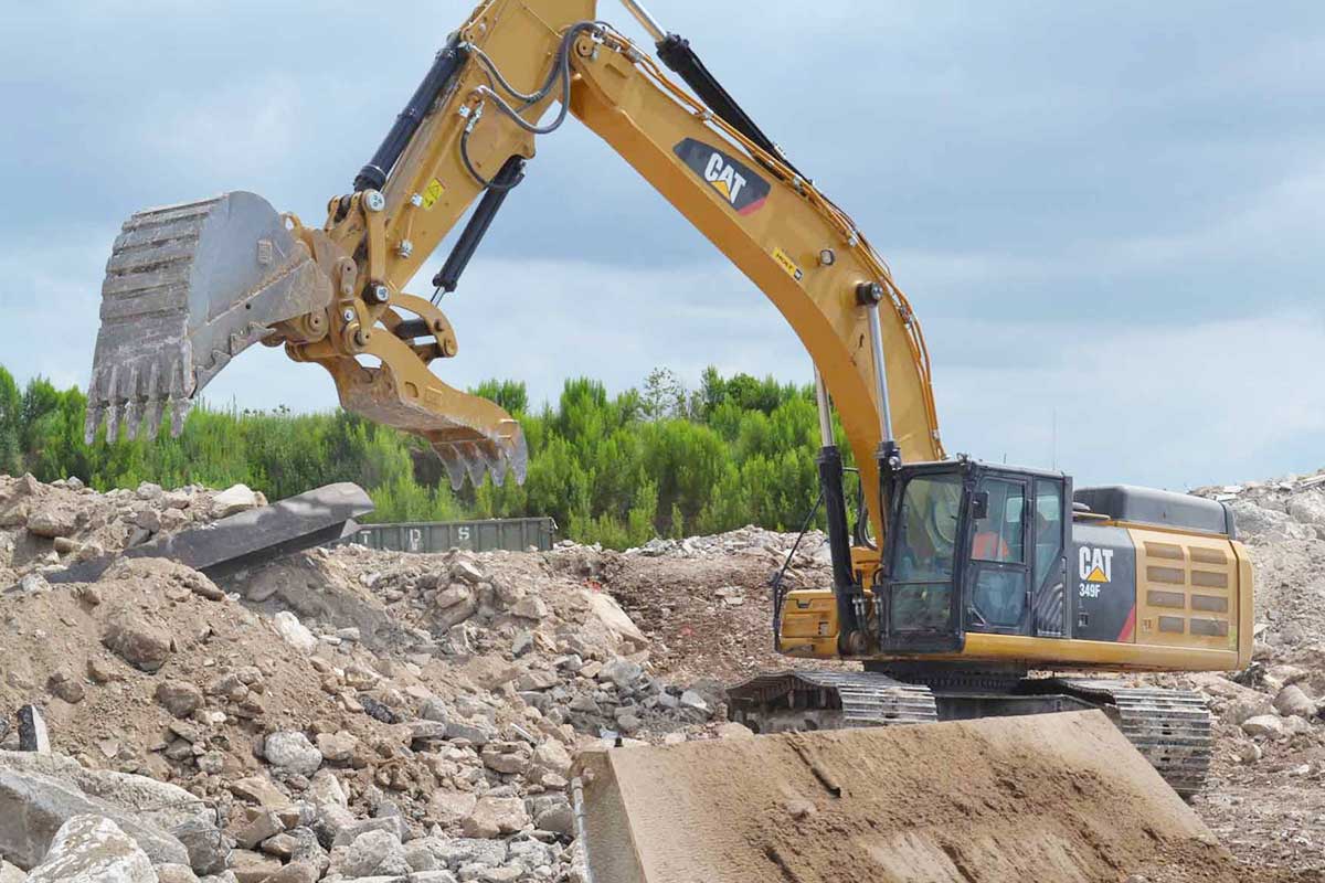 Heavy equipment at work on concrete recycling.