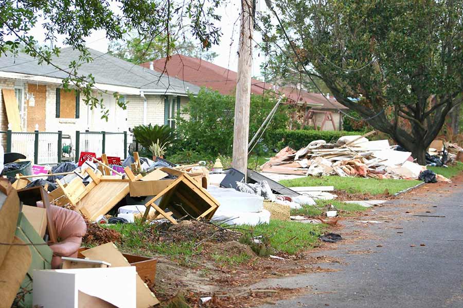 Debris on front yards of homes