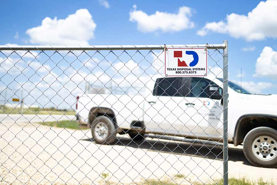 Temporary fencing at a construction site with a TDS truck behind the fence