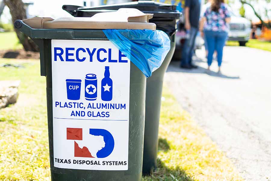 Green TDS recycling cart with tan lid for event recycling with blue bag for event recycling