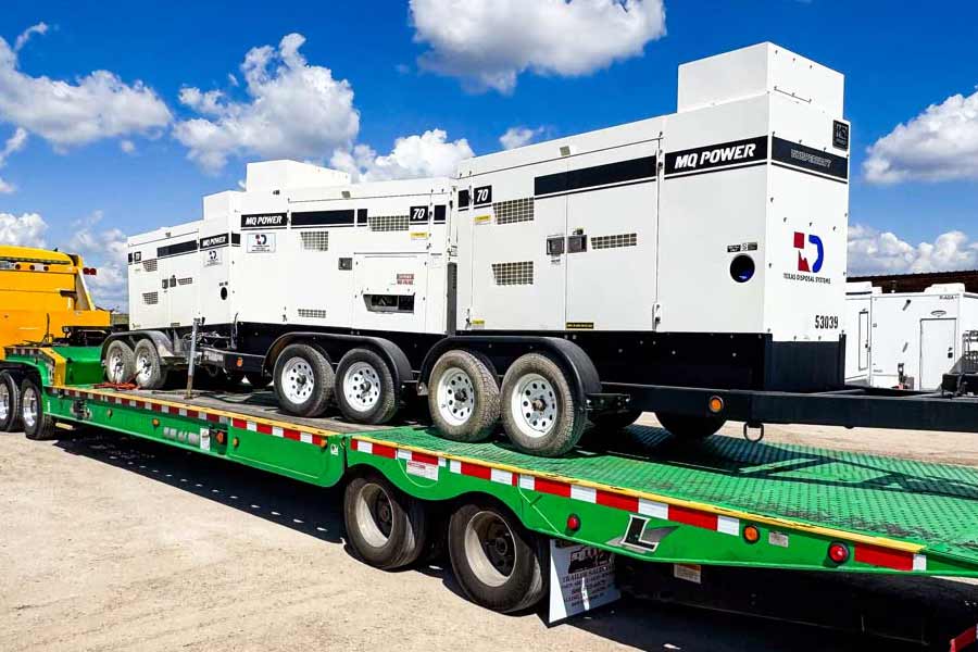 White TDS emergency generators on green truck