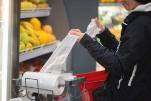 Woman using a grocery bag at the grocery store